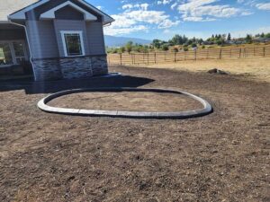 Oval curbing for shrubs and flower garden