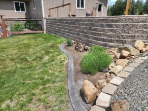 Curbing installed next to retaining wall