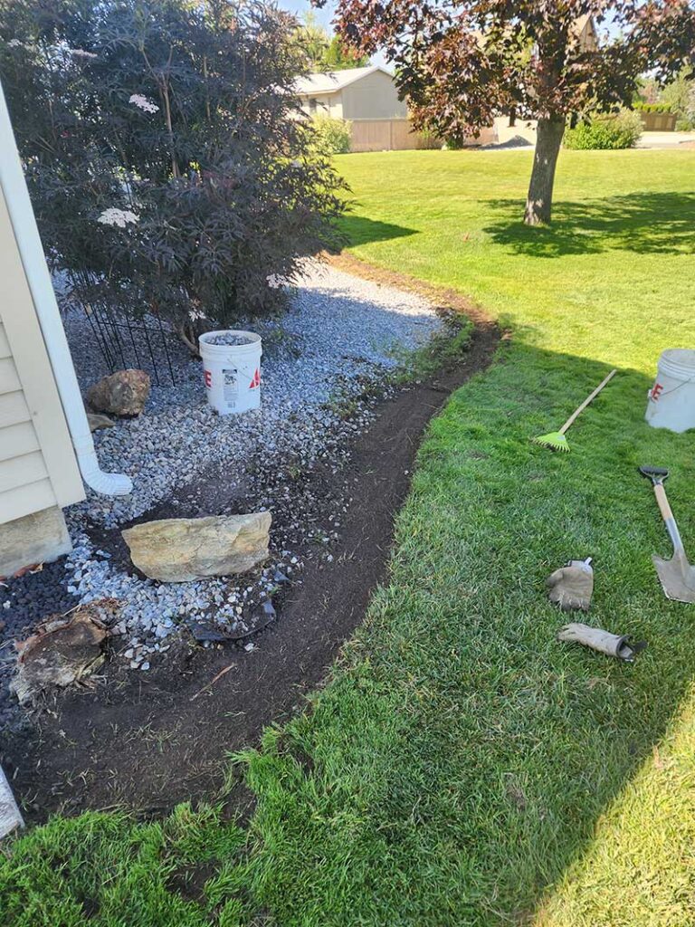 Prep to get ready for new curbing to separate lawn from rock and shrubs.